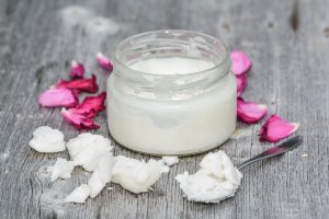 coconut jar close up with petals beauty uses