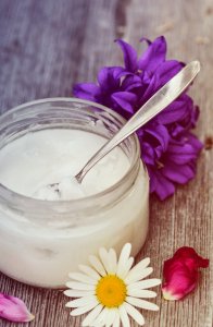 coconut jar with spoon close up flowers beauty uses